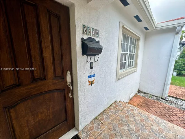 a view of a bedroom with windows and wardrobe