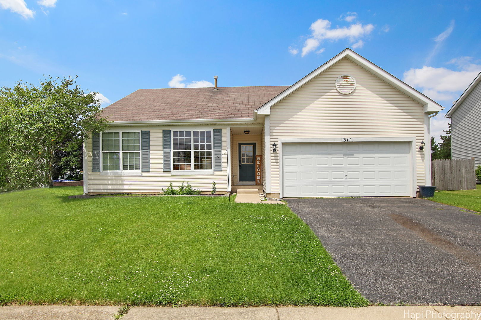 a front view of a house with a yard