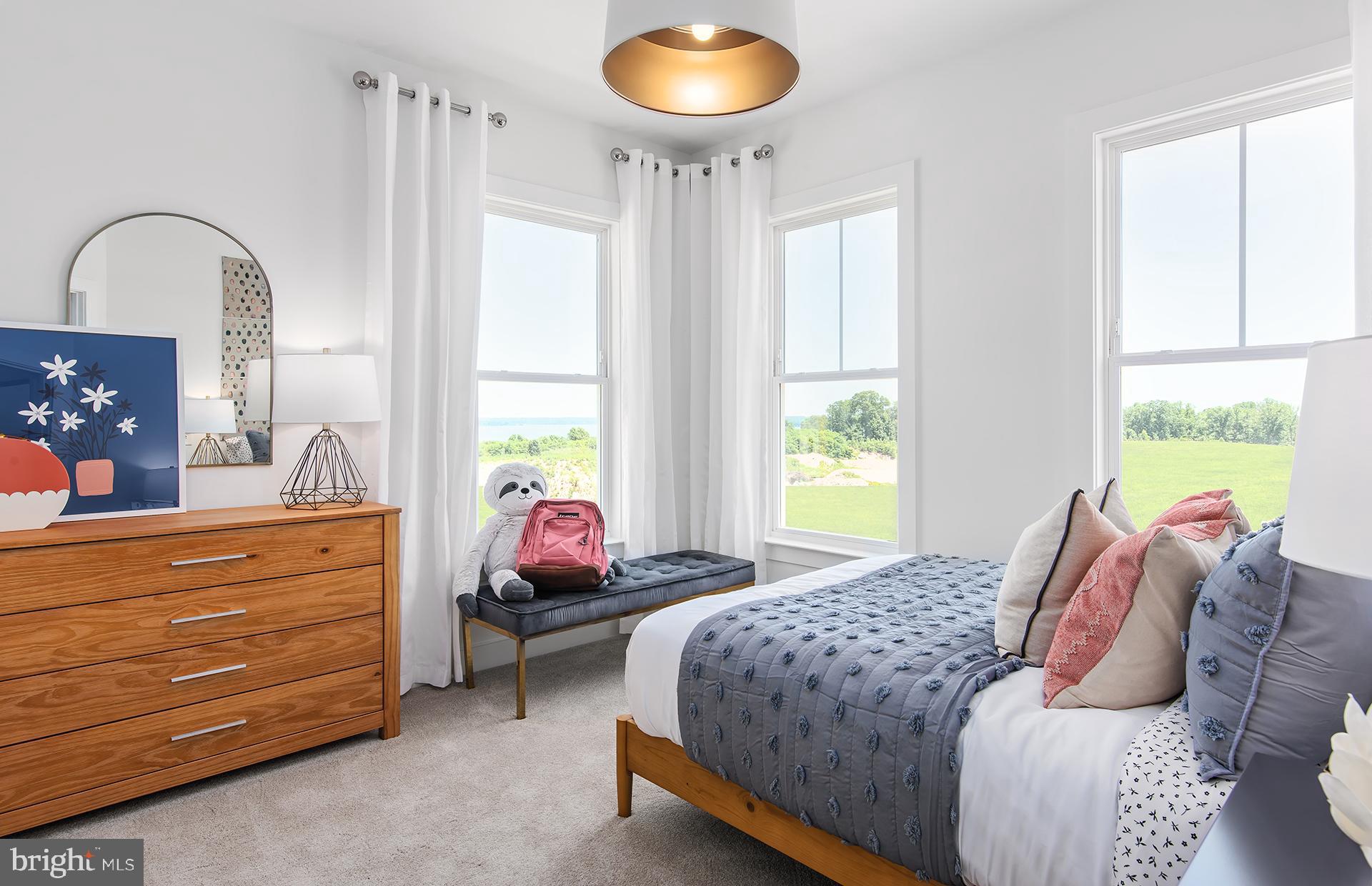 303 Backwater Way Laurel, MD 20724 - Photo 14 of 33 a bedroom with a bed and a chandelier