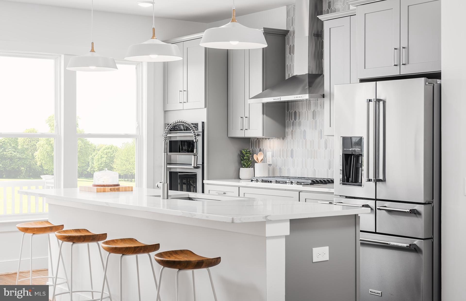 303 Backwater Way Laurel, MD 20724 - Photo 5 of 33 a kitchen with stainless steel appliances granite countertop a refrigerator and a sink