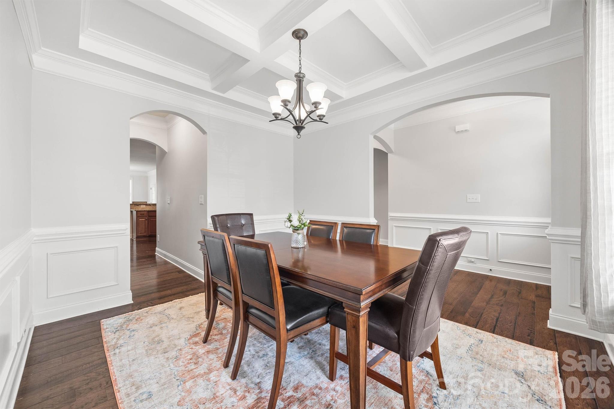 299 Annatto Way Tega Cay, SC 29708 - Photo 6 of 46 a view of a dining room with furniture and a chandelier