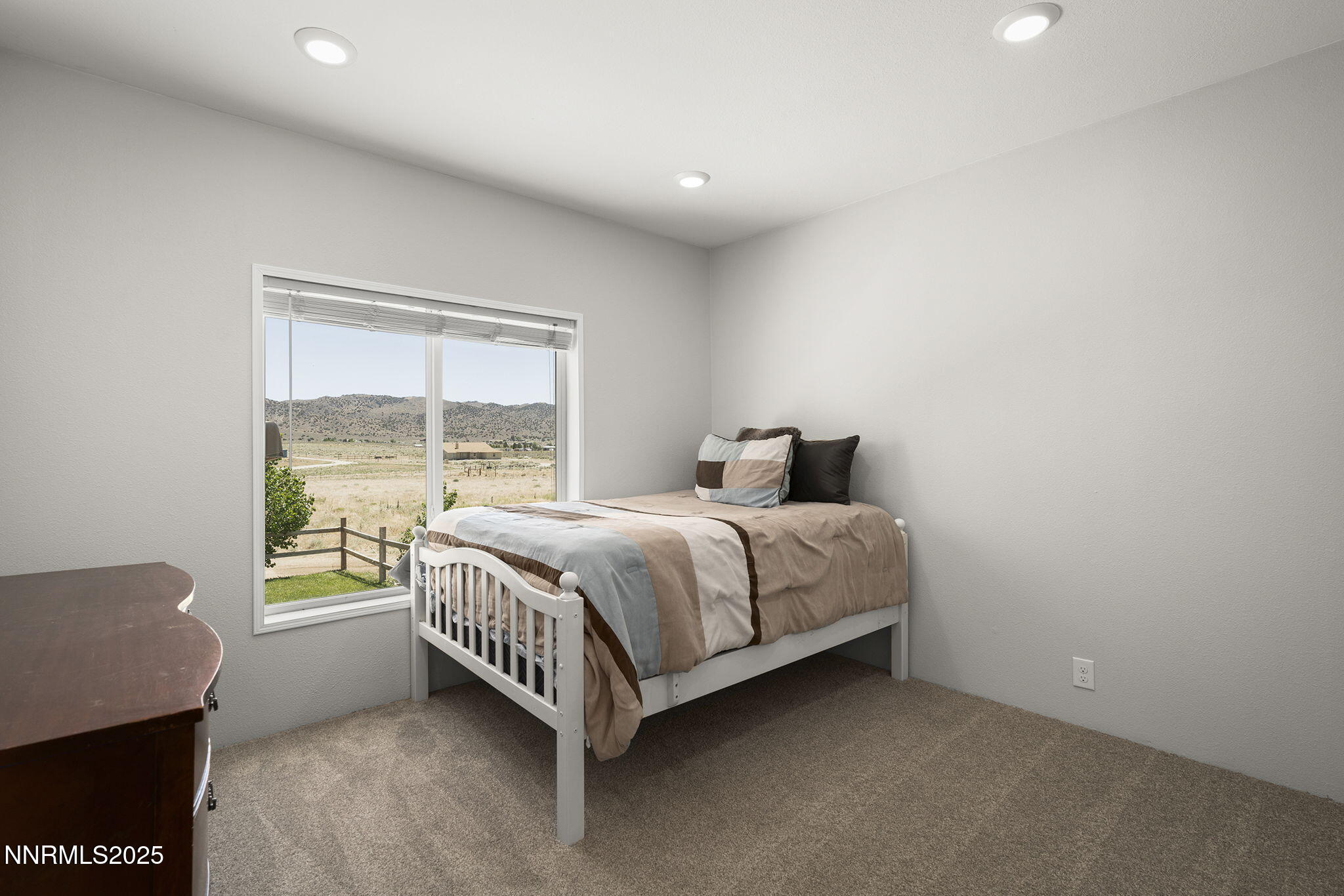 40 Owens Road Reno, NV 89506 - Photo 22 of 39 a bedroom with a bed and window