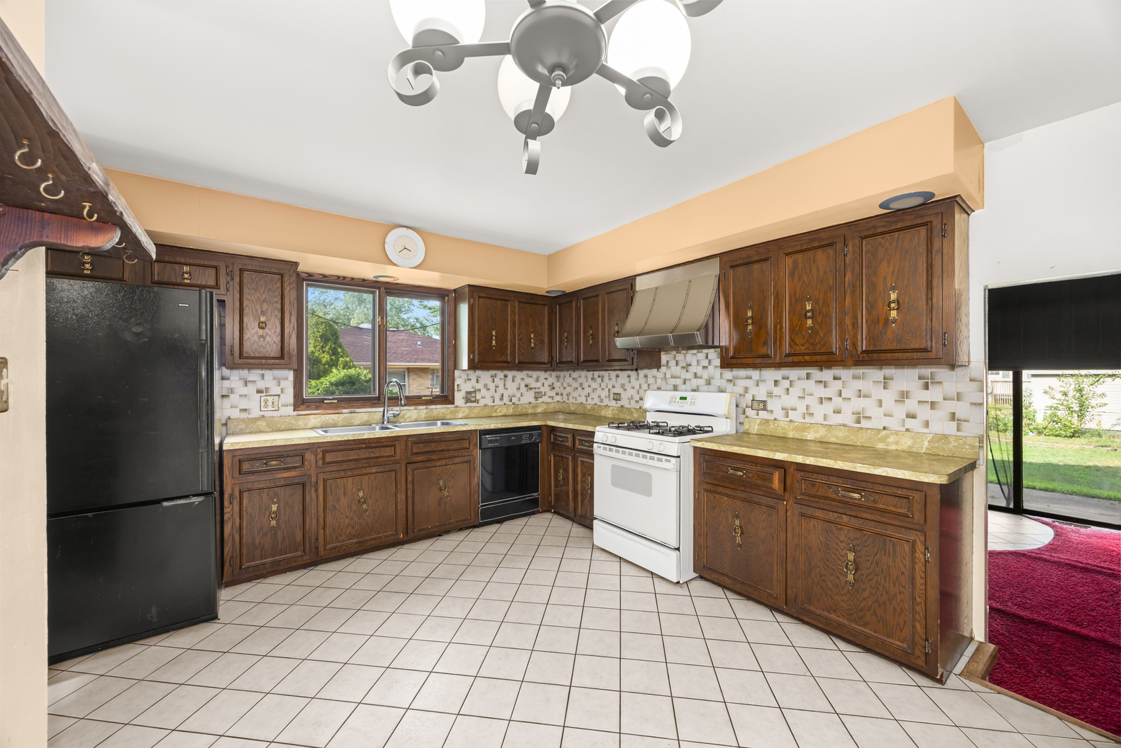 18309 Bock Road Lansing, IL 60438 - Photo 11 of 28 a kitchen with stainless steel appliances granite countertop a refrigerator a sink dishwasher a stove with wooden cabinets