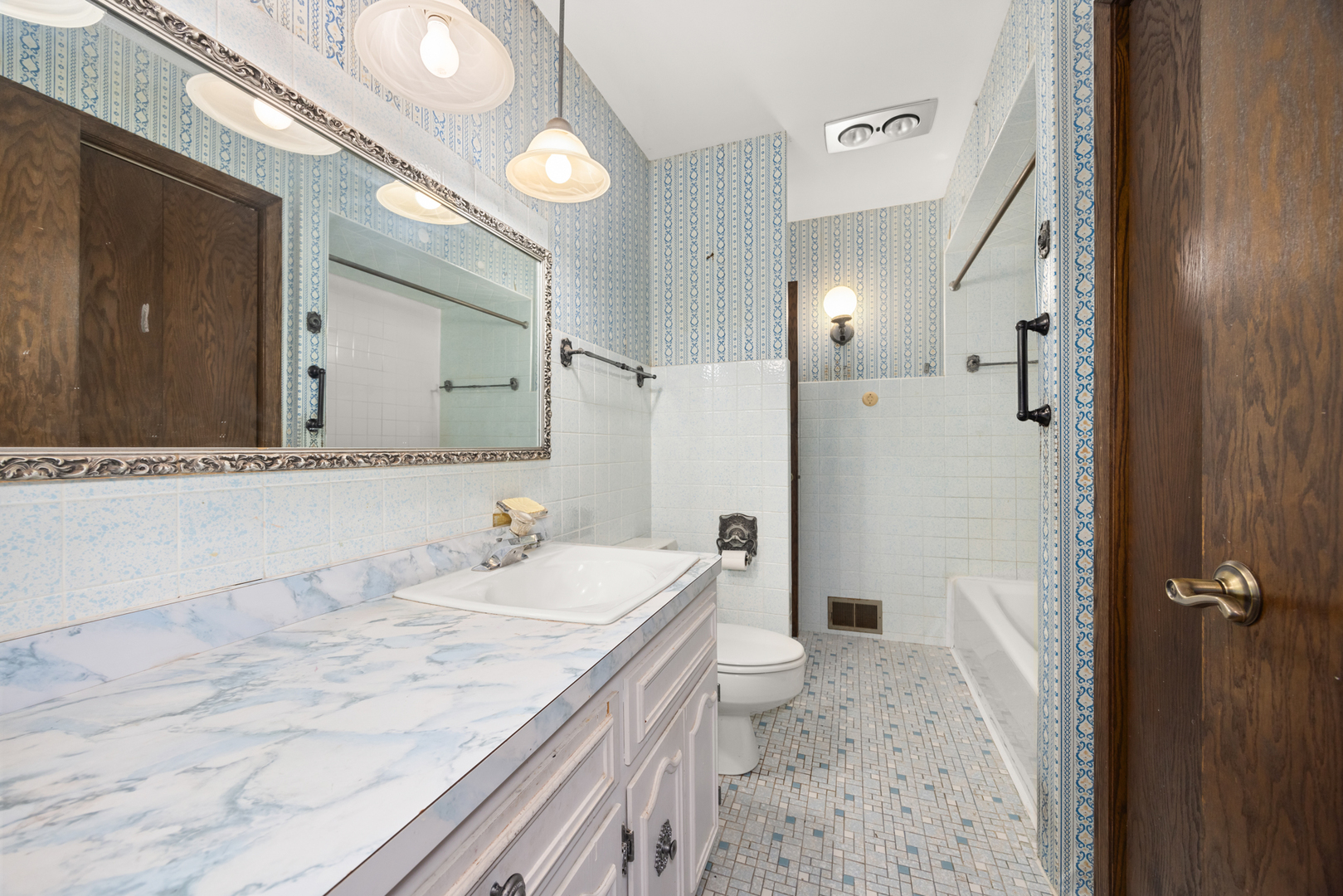 18309 Bock Road Lansing, IL 60438 - Photo 16 of 28 a bathroom with a granite countertop sink and a mirror