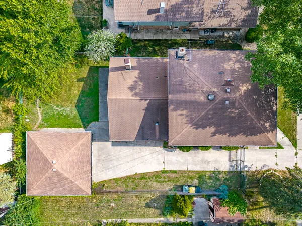 an aerial view of a house with a garden