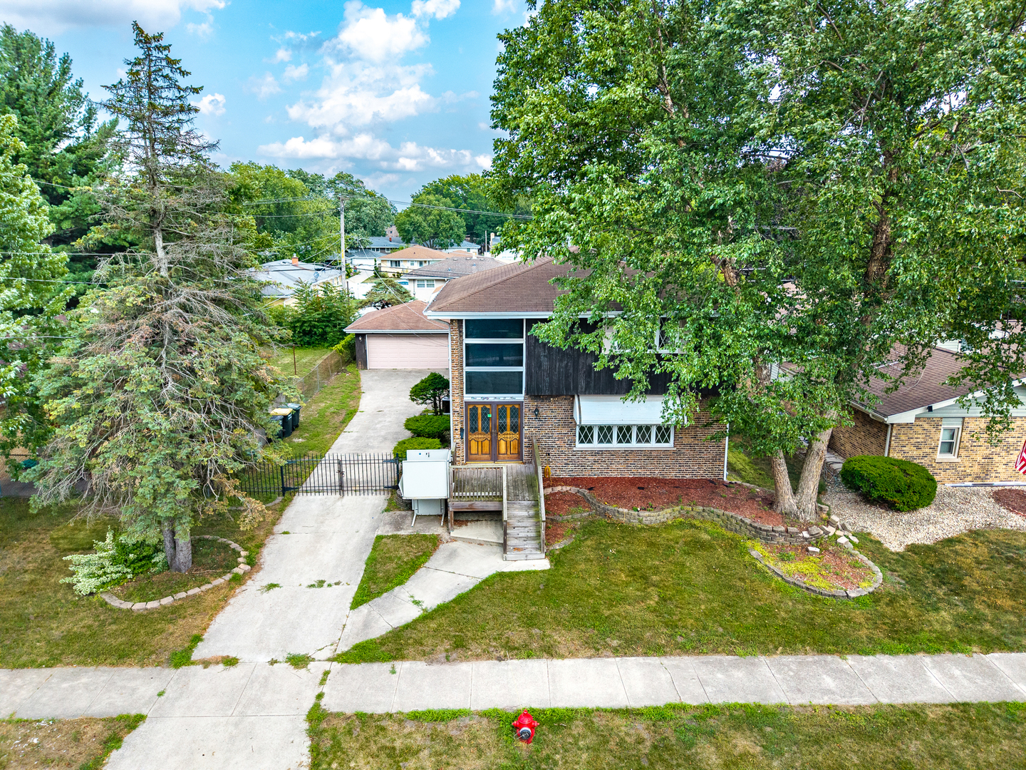 18309 Bock Road Lansing, IL 60438 - Photo 5 of 28 a view of a house with backyard porch and sitting area