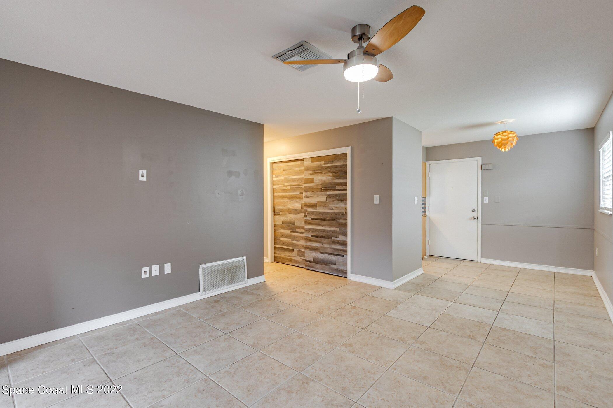 714 Catalina Road, Unit 9 Cocoa Beach, FL 32931 - Photo 13 of 33 an empty room with closet and a ceiling fan