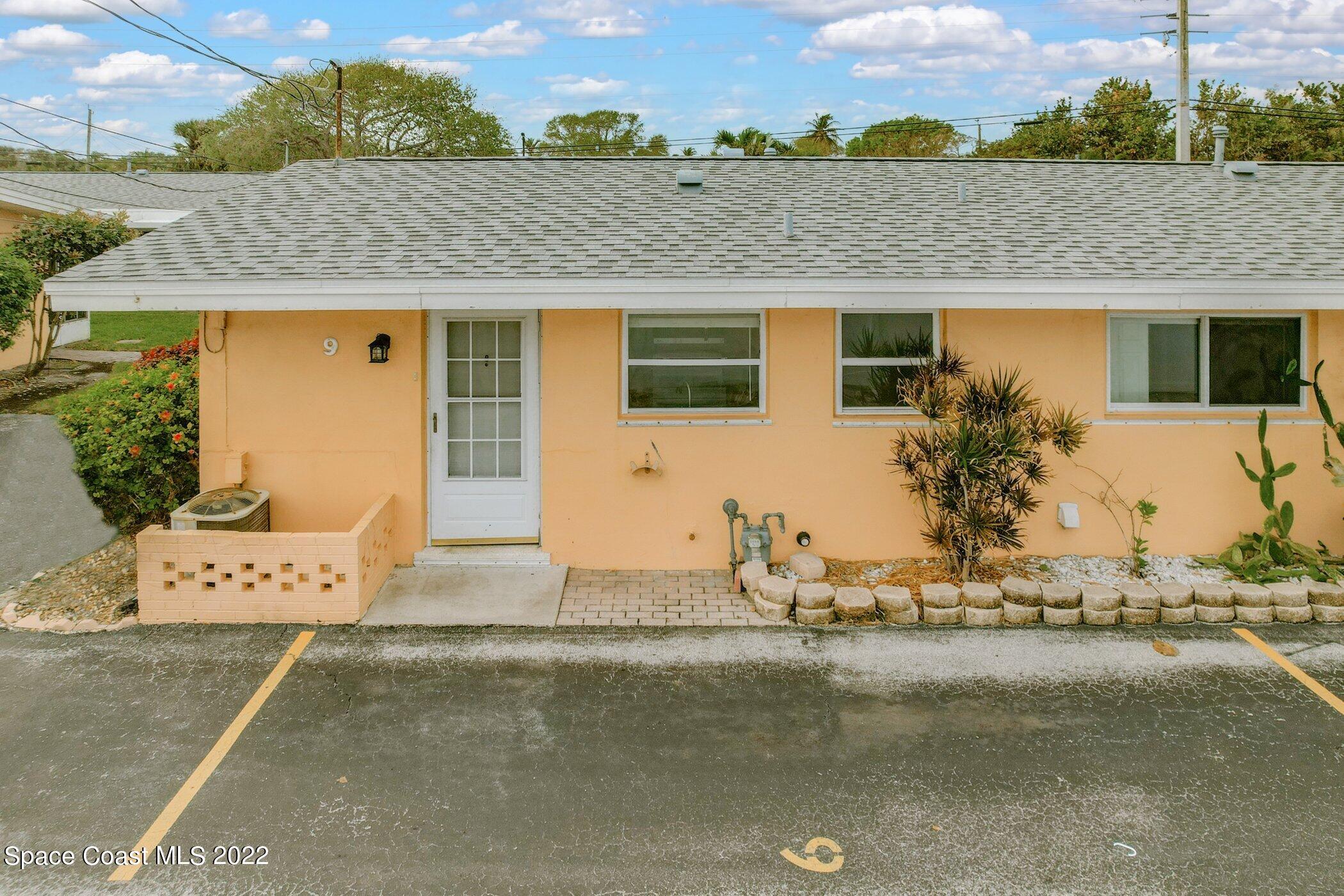 714 Catalina Road, Unit 9 Cocoa Beach, FL 32931 - Photo 25 of 33 an aerial view of a house with a yard