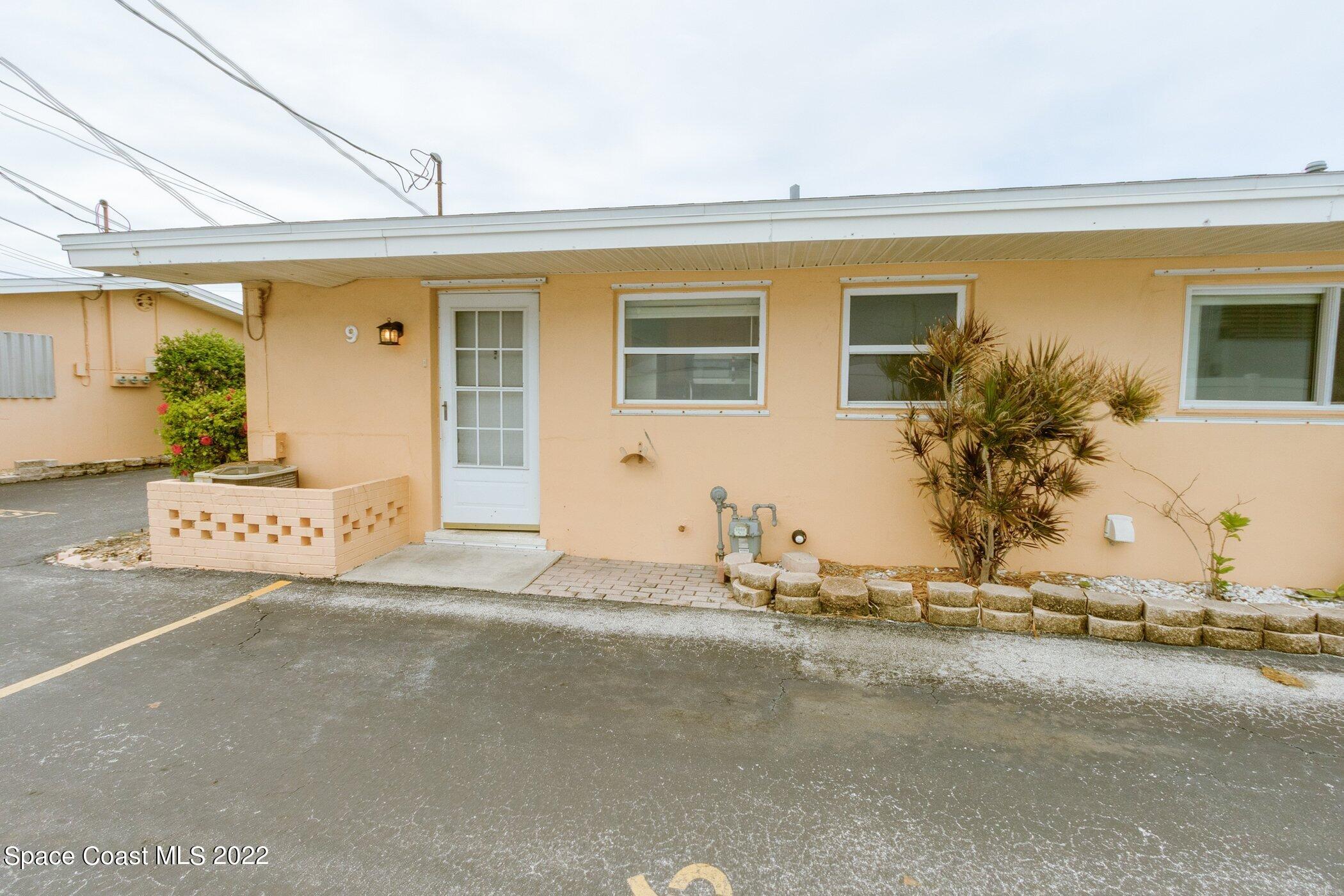 714 Catalina Road, Unit 9 Cocoa Beach, FL 32931 - Photo 29 of 33 a front view of a house with a outdoor space