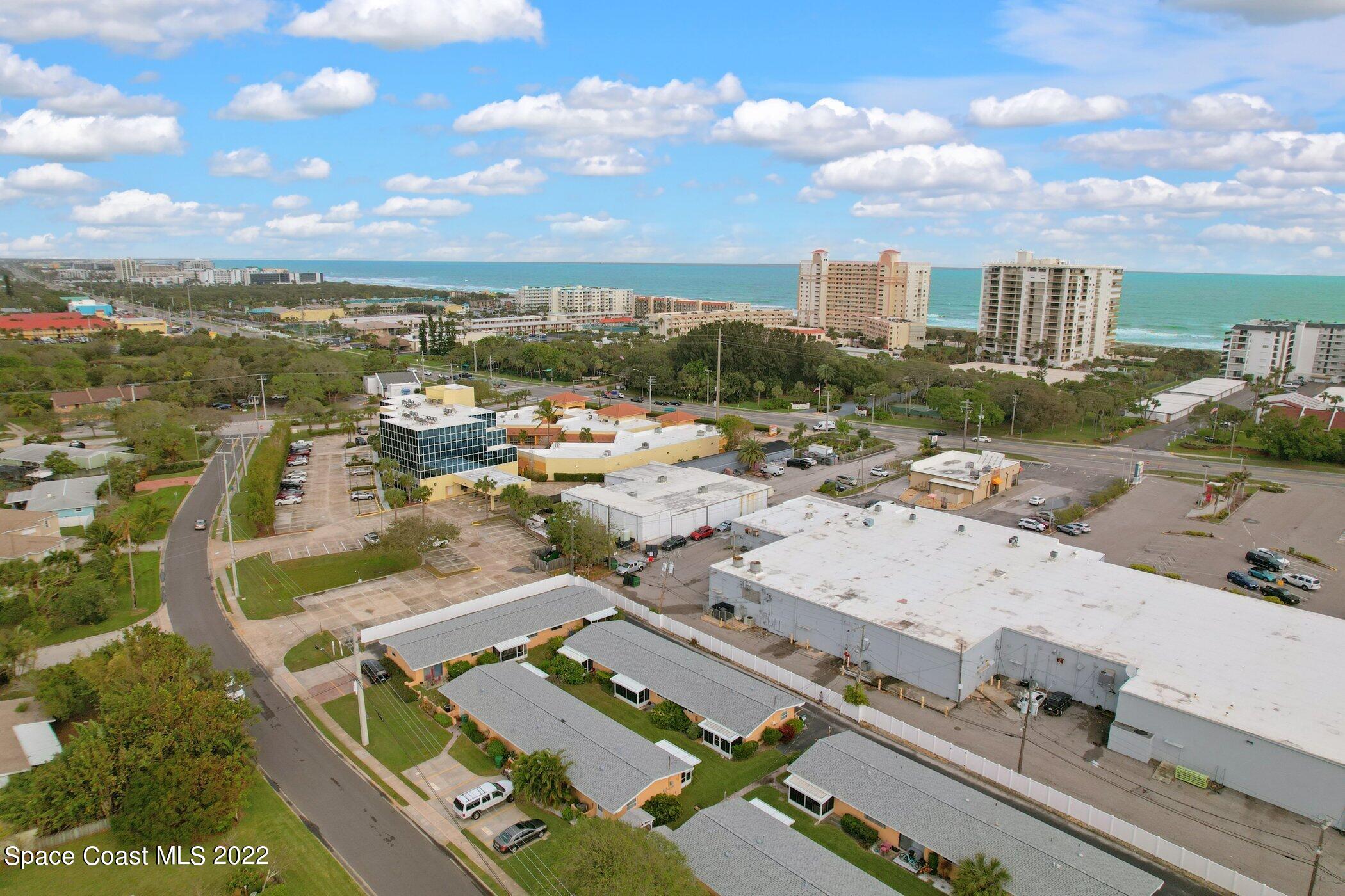 714 Catalina Road, Unit 9 Cocoa Beach, FL 32931 - Photo 32 of 33 an aerial view of residential houses with outdoor space