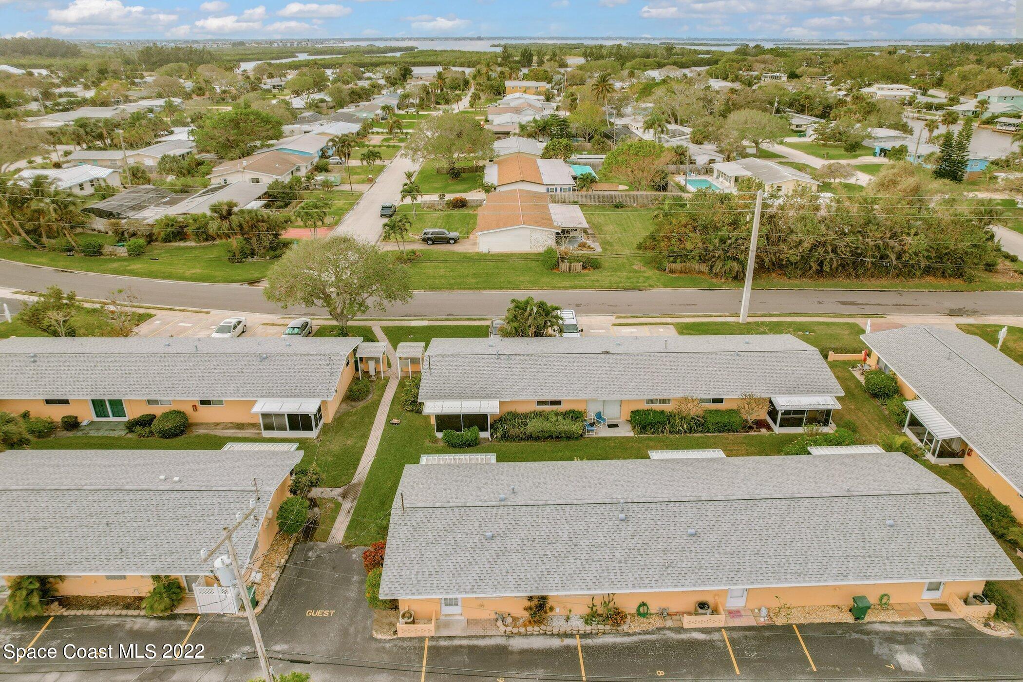 714 Catalina Road, Unit 9 Cocoa Beach, FL 32931 - Photo 33 of 33 a view of a swimming pool with a yard