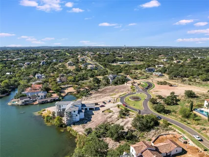 an aerial view of a houses with ocean view