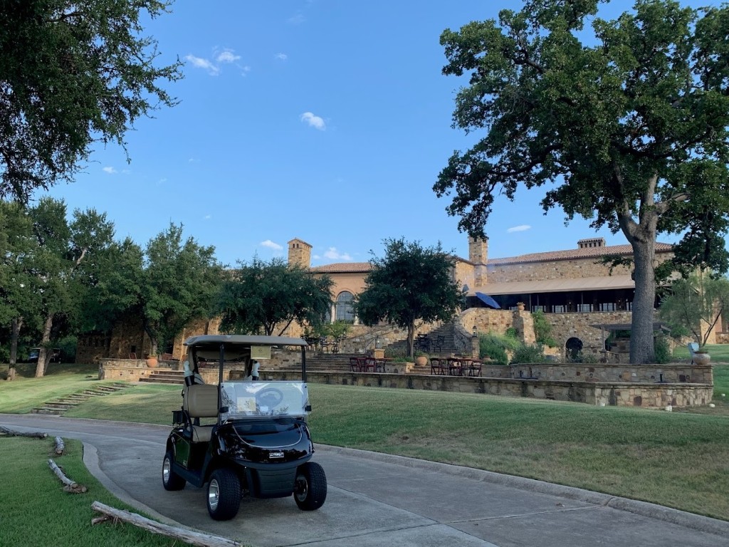 1221 Apache Tears Horseshoe Bay, TX 78657 - Photo 17 of 20 a car parked in front of a house and a garden