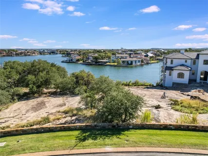 an aerial view of a house with a lake view