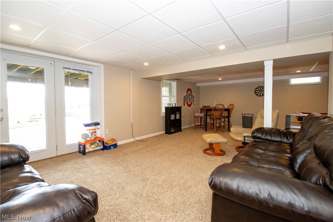 1644 Moore Road Wooster, OH 44691 - Photo 25 of 30 Carpeted living room with a paneled ceiling and plenty of natural light