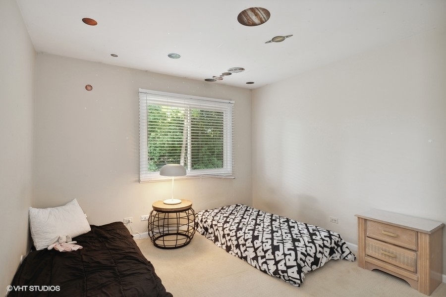 103 Viola Court Rolling Meadows, IL 60008 - Photo 17 of 27 a bedroom with bed and window