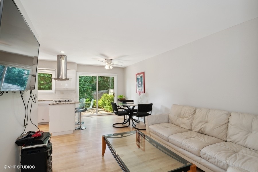 103 Viola Court Rolling Meadows, IL 60008 - Photo 6 of 27 a living room with furniture and a large window
