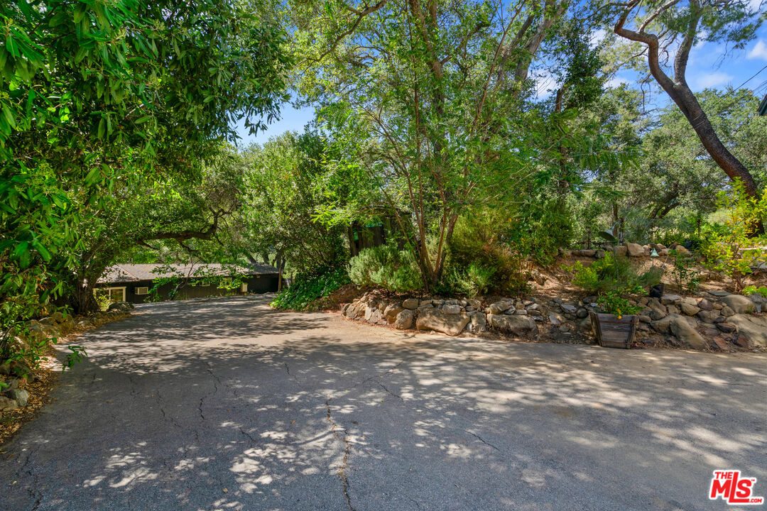 20912 Fontaine Road Topanga, CA 90290 - Photo 40 of 52 a view of a dirt road with trees