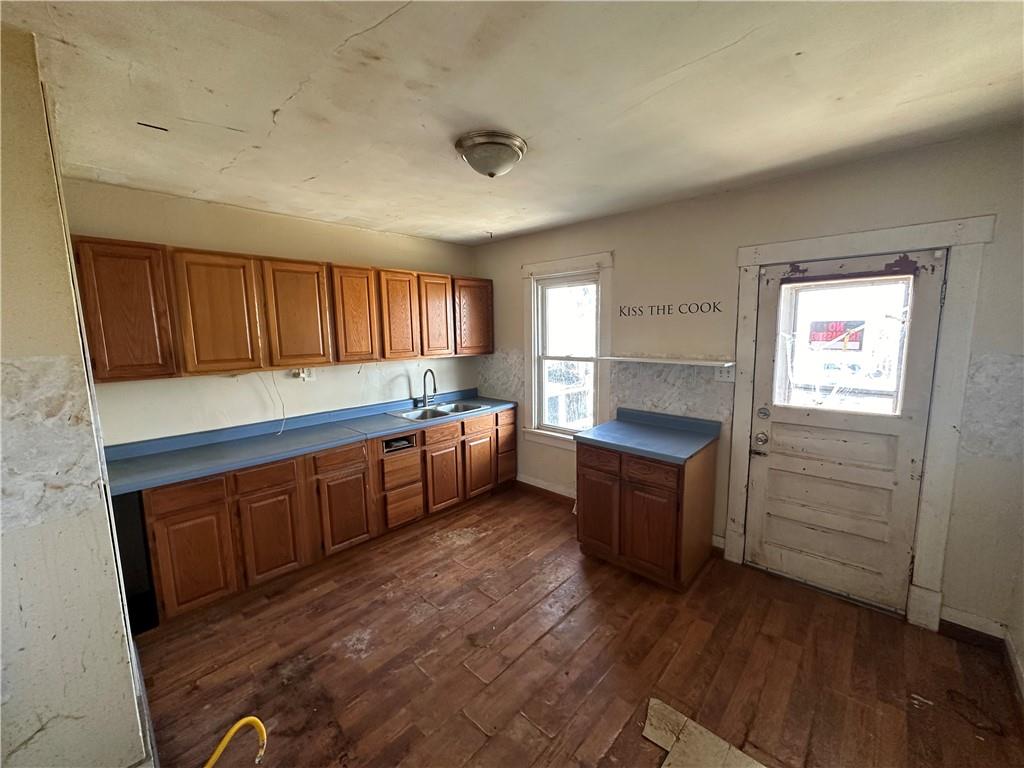 1616 3rd Avenue Arnold, PA 15068 - Photo 5 of 18 a kitchen with wooden floors and wooden cabinets