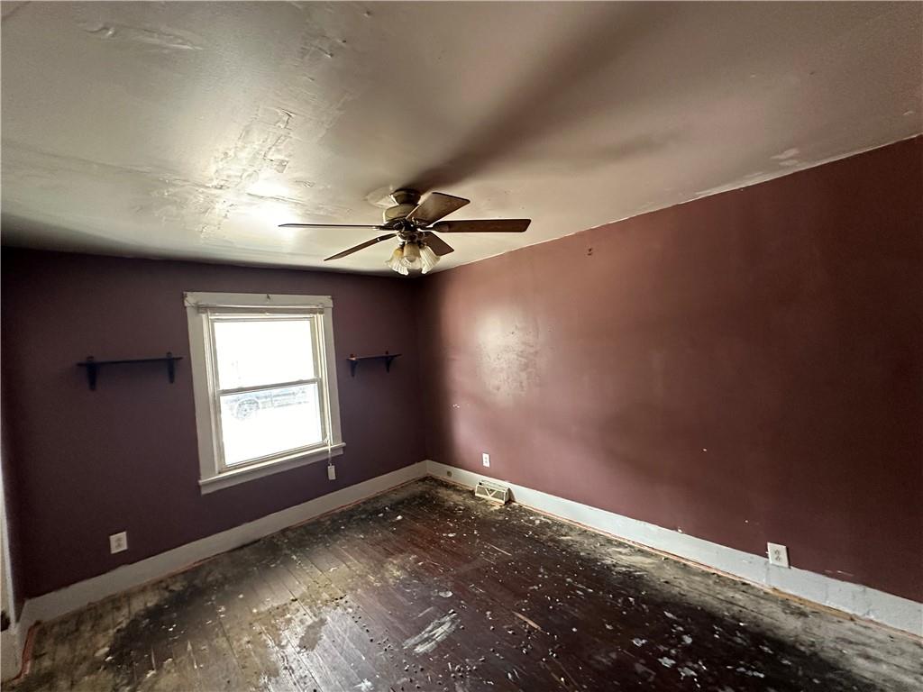 1616 3rd Avenue Arnold, PA 15068 - Photo 10 of 18 a view of empty room with window and ceiling fan