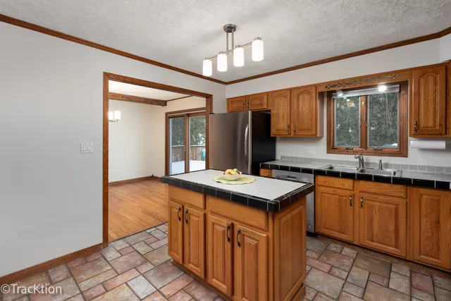 a kitchen that has a sink and a stove in it
