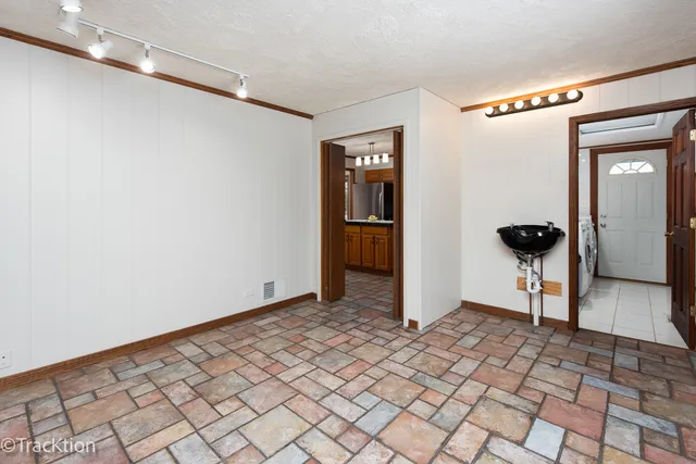 a view of a hallway with wooden floor and a in a corridor