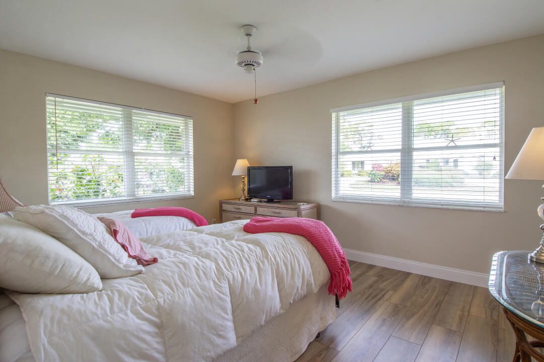 3372 Southeast Court Drive Stuart, FL 34997 - Photo 12 of 33 a bedroom with bed and a window