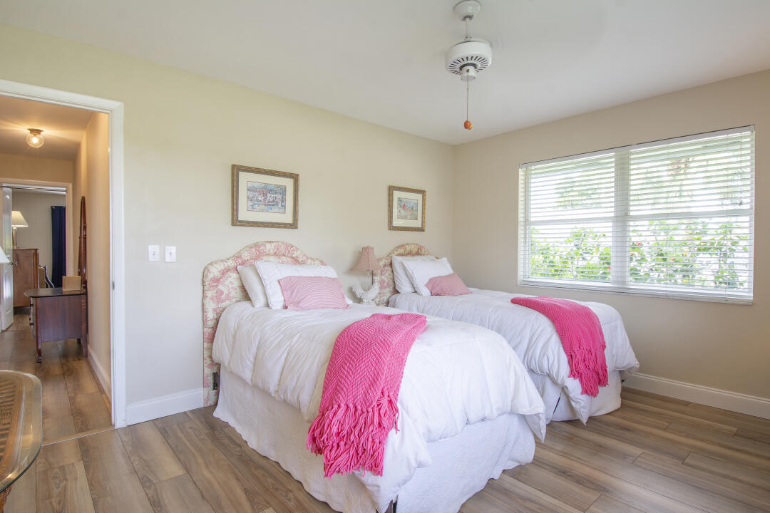 3372 Southeast Court Drive Stuart, FL 34997 - Photo 14 of 33 a bed room with two beds and a window