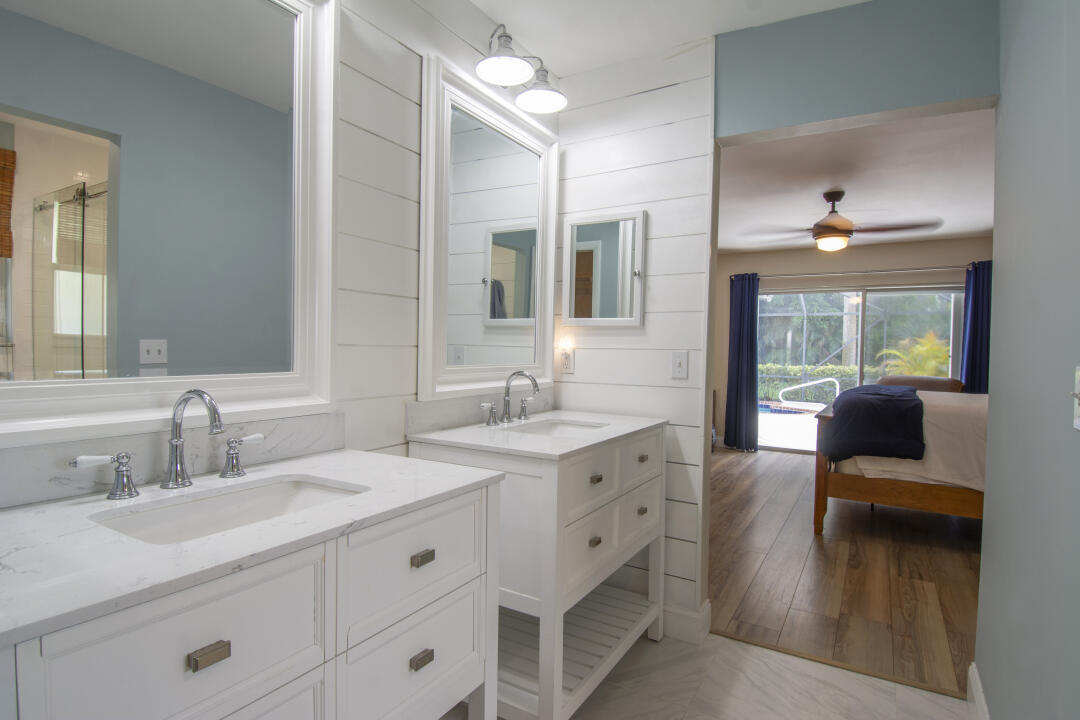 3372 Southeast Court Drive Stuart, FL 34997 - Photo 19 of 33 a en suite bathroom with double sink and a mirror