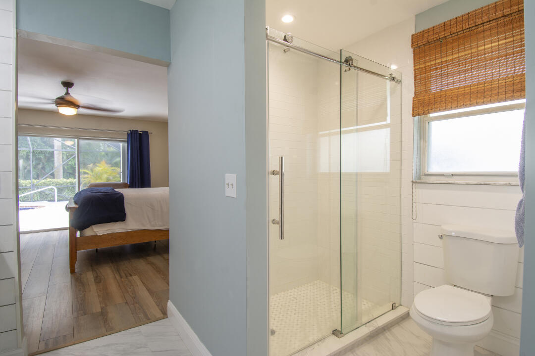 3372 Southeast Court Drive Stuart, FL 34997 - Photo 20 of 33 a bathroom with a shower and a toilet