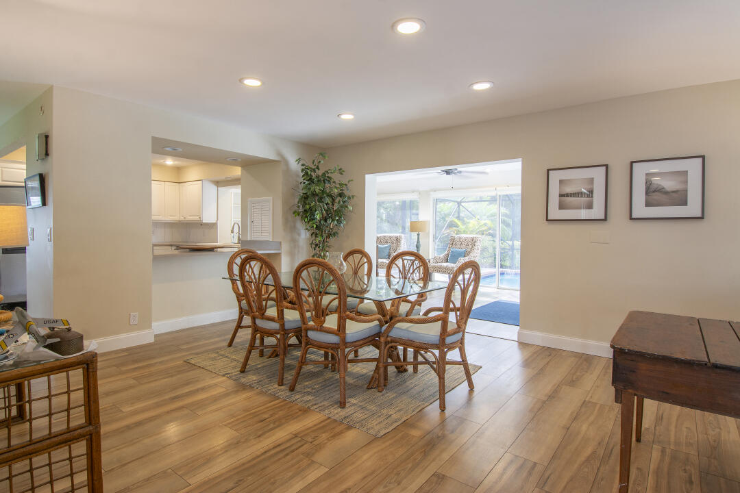 3372 Southeast Court Drive Stuart, FL 34997 - Photo 21 of 33 a view of a dining room with furniture and wooden floor