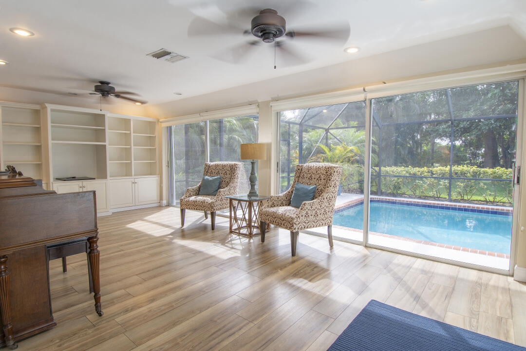 3372 Southeast Court Drive Stuart, FL 34997 - Photo 22 of 33 a living room with furniture a window and a table