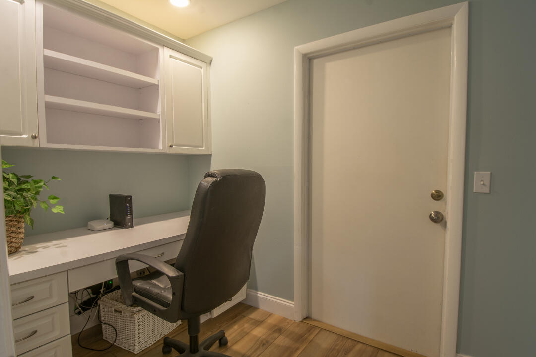 3372 Southeast Court Drive Stuart, FL 34997 - Photo 24 of 33 a view of a workspace with furniture and a window