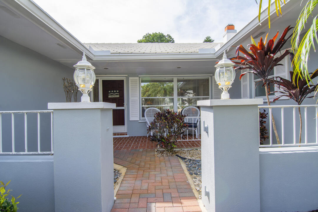 3372 Southeast Court Drive Stuart, FL 34997 - Photo 3 of 33 a view of living room with furniture and a fireplace