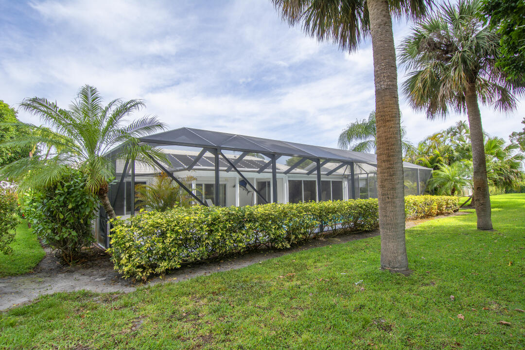 3372 Southeast Court Drive Stuart, FL 34997 - Photo 32 of 33 a front view of multi story residential apartment building with a yard