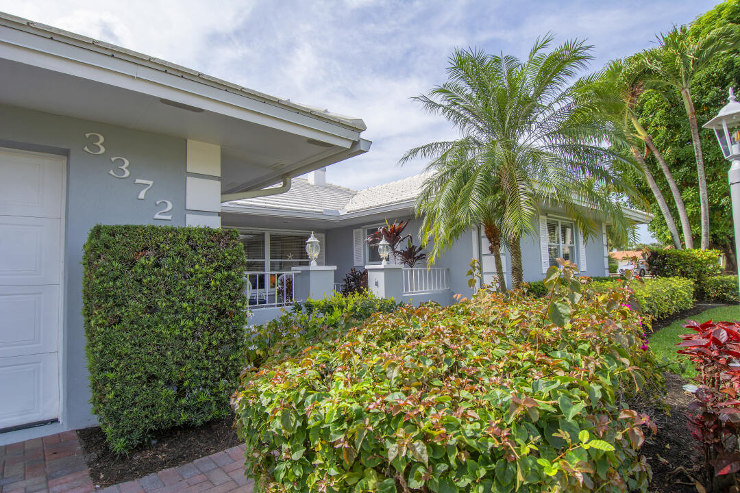 3372 Southeast Court Drive Stuart, FL 34997 - Photo 33 of 33 a front view of a house with a yard