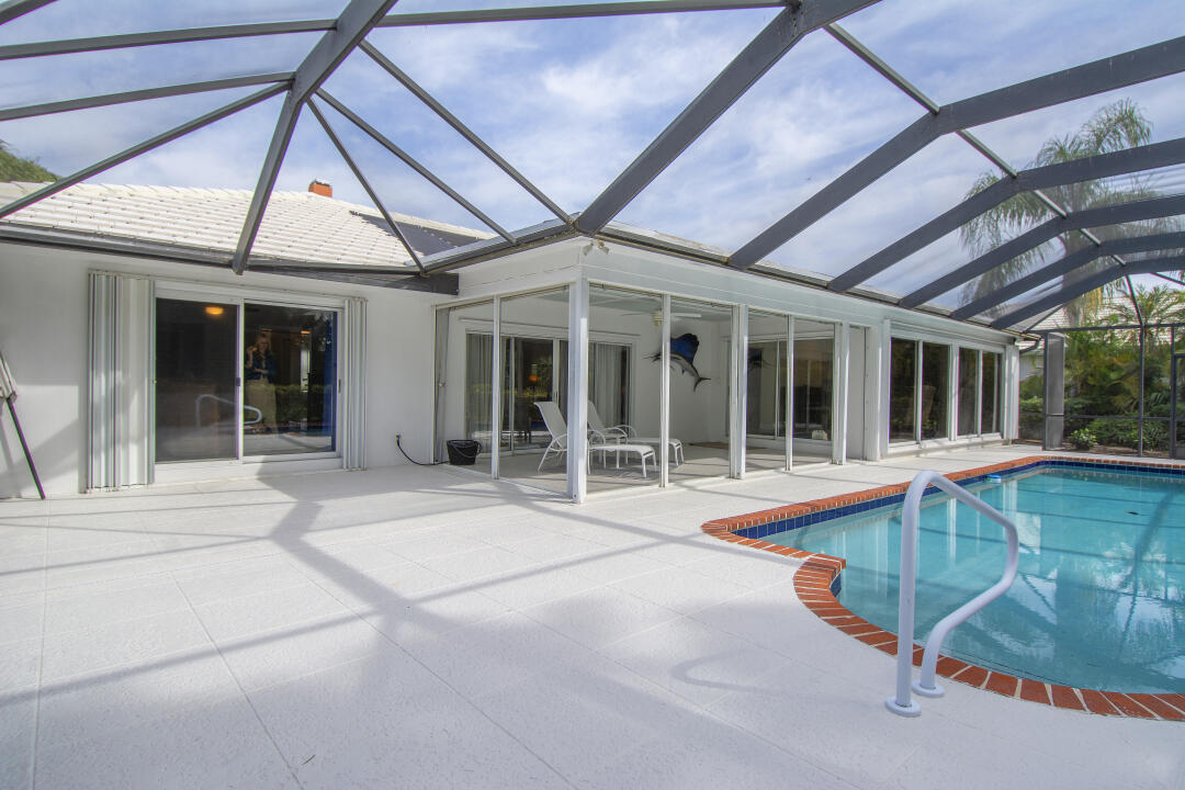 3372 Southeast Court Drive Stuart, FL 34997 - Photo 6 of 33 a view of a house with a swimming pool