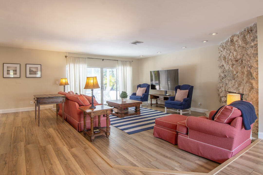 3372 Southeast Court Drive Stuart, FL 34997 - Photo 7 of 33 a living room with furniture and a wooden floor