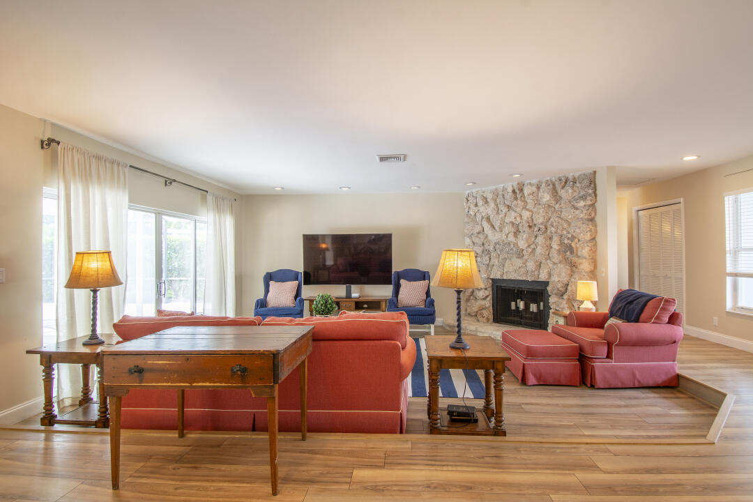 3372 Southeast Court Drive Stuart, FL 34997 - Photo 8 of 33 a living room with fireplace furniture and a window