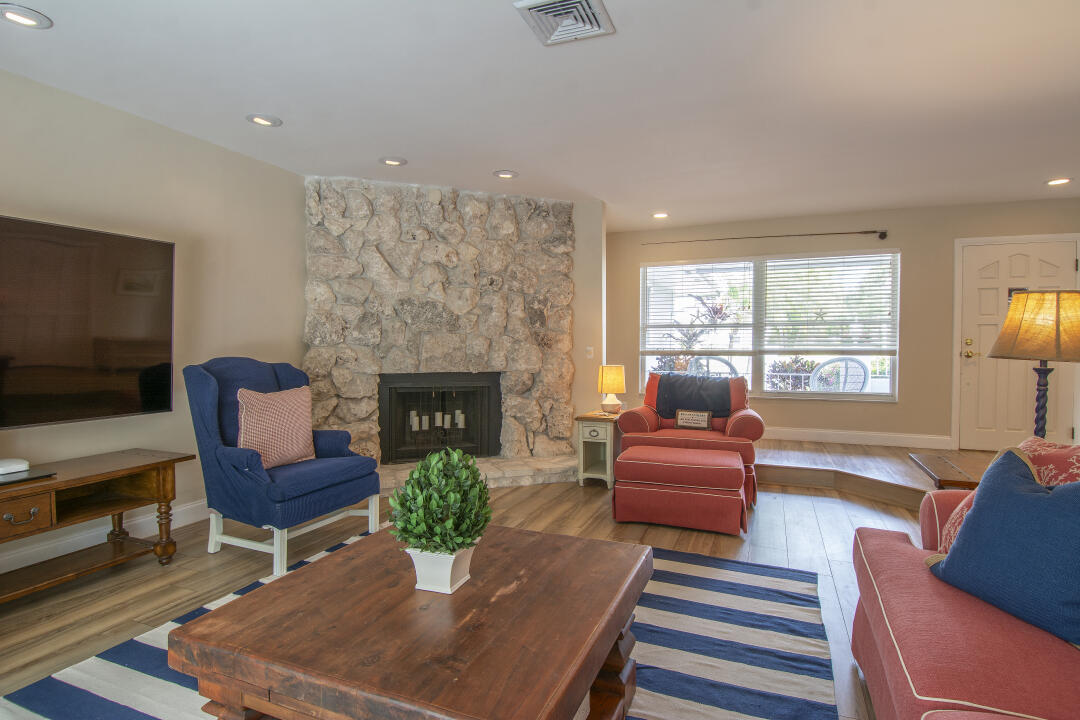 3372 Southeast Court Drive Stuart, FL 34997 - Photo 10 of 33 a living room with furniture fireplace and window