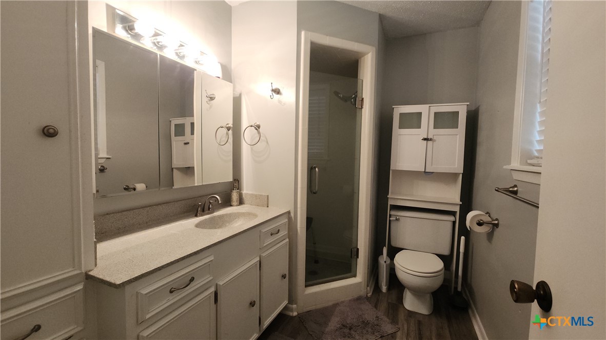 204 Cherokee Lane Victoria, TX 77901 - Photo 11 of 14 a bathroom with a sink a toilet and shower
