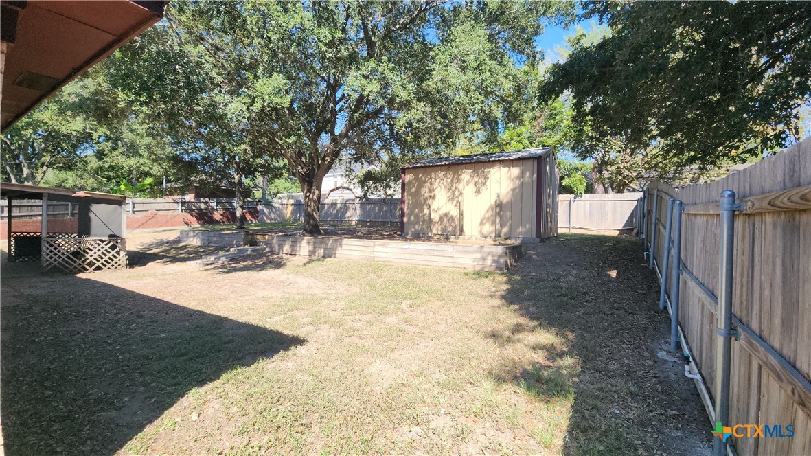 204 Cherokee Lane Victoria, TX 77901 - Photo 12 of 14 a view of a yard with a tree