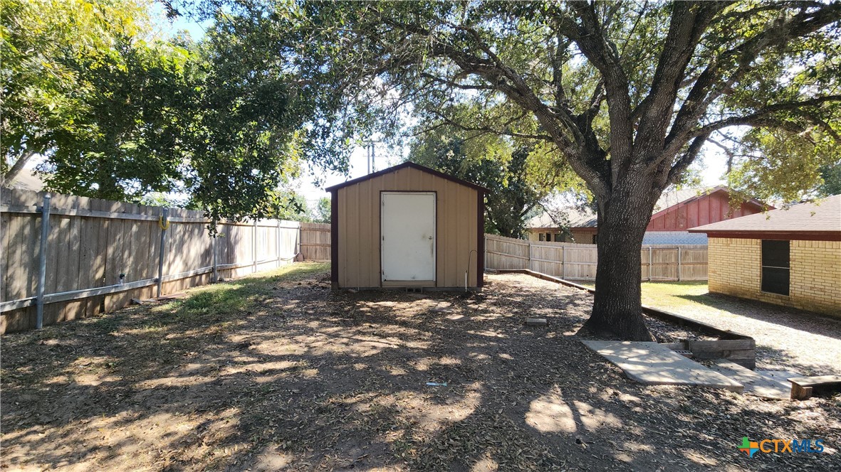 204 Cherokee Lane Victoria, TX 77901 - Photo 13 of 14 a front view of a house with a yard and garage