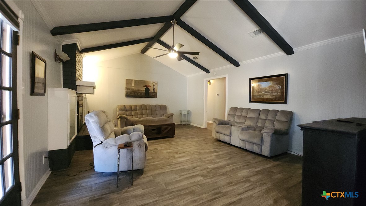 204 Cherokee Lane Victoria, TX 77901 - Photo 2 of 14 a living room with furniture and a fireplace