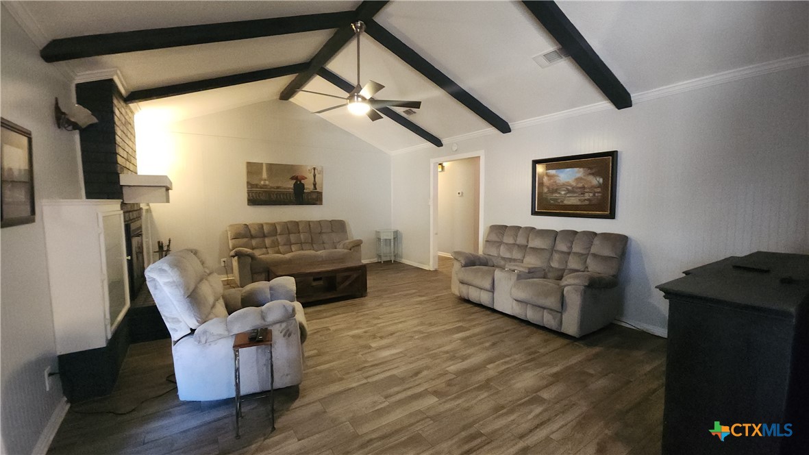 204 Cherokee Lane Victoria, TX 77901 - Photo 4 of 14 a living room with furniture and a flat screen tv