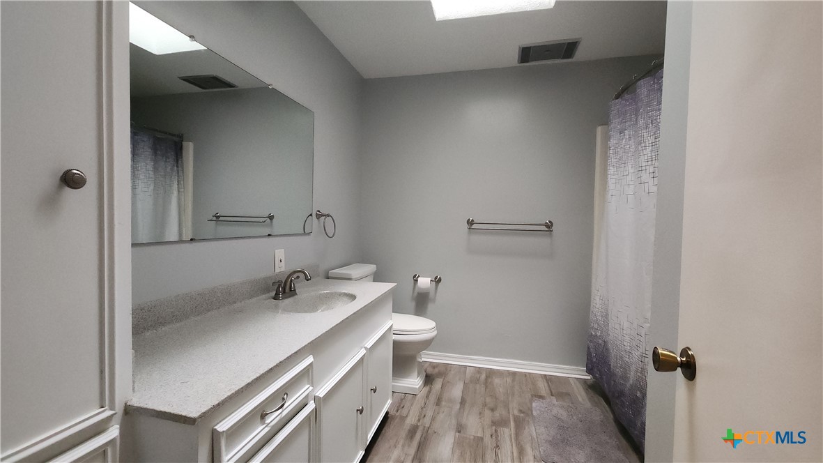 204 Cherokee Lane Victoria, TX 77901 - Photo 10 of 14 a bathroom with a sink a toilet and shower