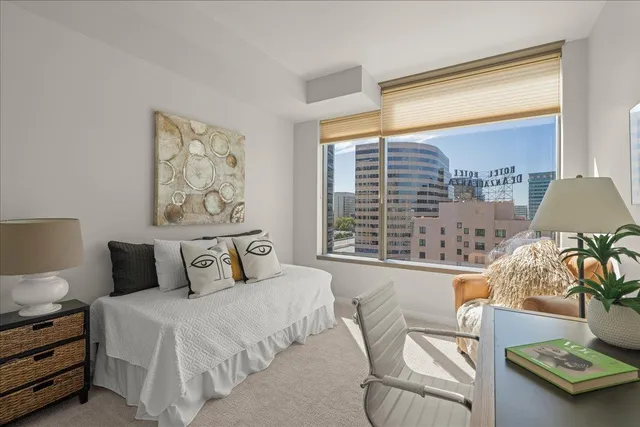 a bedroom with furniture and a window