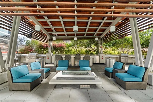 a view of a patio with couches and potted plants