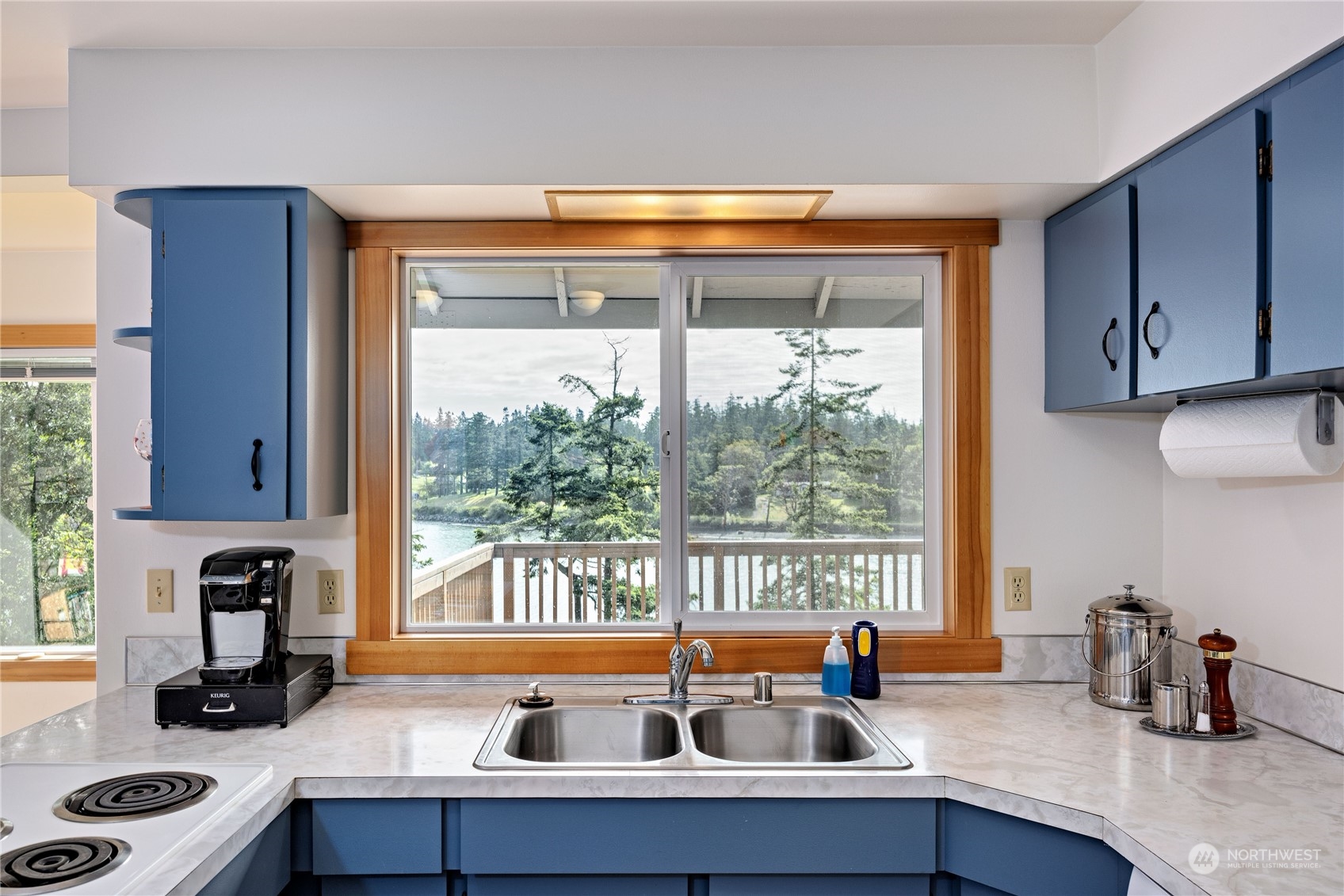 1511 Griffith Point Road Nordland, WA 98358 - Photo 13 of 40 a kitchen with a sink and a large window