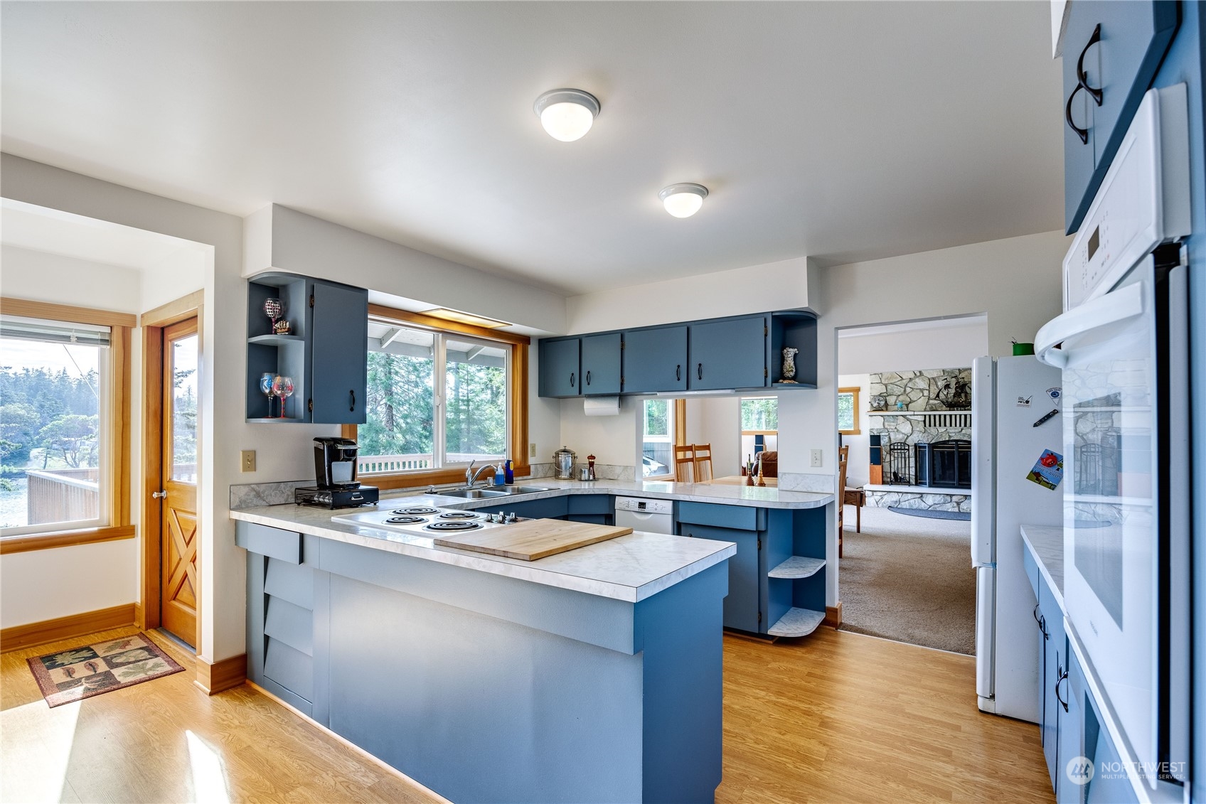 1511 Griffith Point Road Nordland, WA 98358 - Photo 14 of 40 a kitchen with stainless steel appliances a stove a refrigerator and a refrigerator